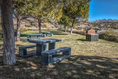 a group of picnic tables in a park at Sir Anthony Luxury in Albufeira