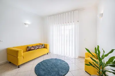 a living room with a couch and a fireplace at VILLA LINDA Palace in Guia