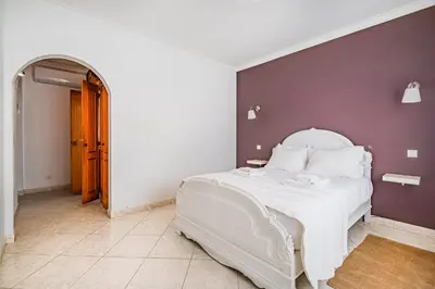 a living room with a couch and a table at VILLA LINDA Palace in Guia