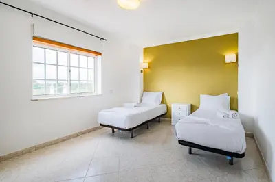 a ping pong table with a ball on top of it at VILLA LINDA Palace in Guia