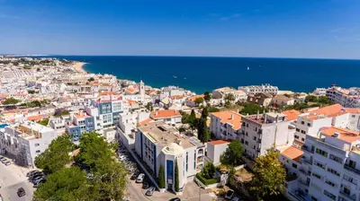 an aerial view of a city and the ocean at London Old Town Apartment in Albufeira