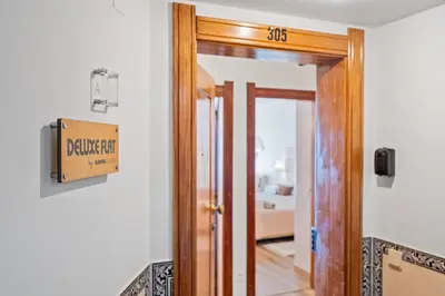 a sign on a door in a room at Deluxe Flat by Albufeira Holidays in Albufeira