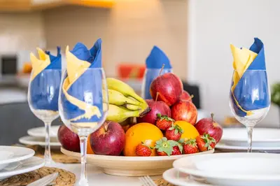 a bowl of fruit on a table with wine glasses at Apartment Venice by Algarve Vacation in Albufeira