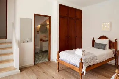 a kitchen with green cabinets and a sink and a refrigerator at Apartments in Albufeira - Old Town in Albufeira