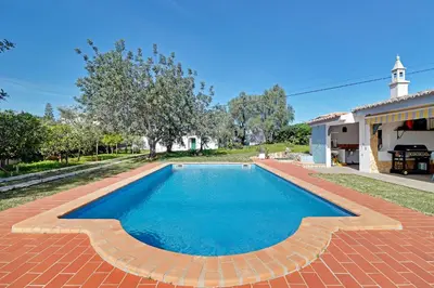 a swimming pool in the backyard of a house at Casal dos Machados - Vista Mar in Benfarras