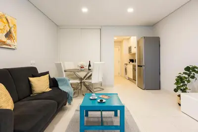 a living room with a couch and a table at MARC - Vilamoura in Vilamoura