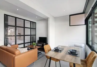 a living room with a table and a couch at Cosy Loft in Vilamoura in Vilamoura