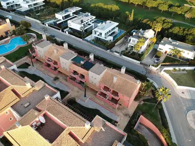 an overhead view of a suburb with houses and a road at Beautiful Family T3 Townhouse with Pool Vilamoura in Vilamoura