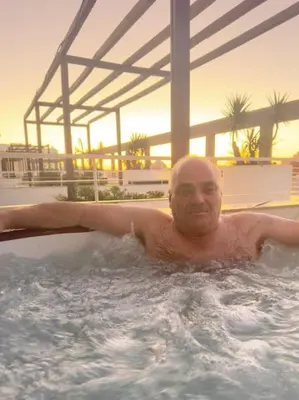 a man in a bath tub in a swimming pool at Newly refurbished 2 bed appt Vilamoura in Vilamoura