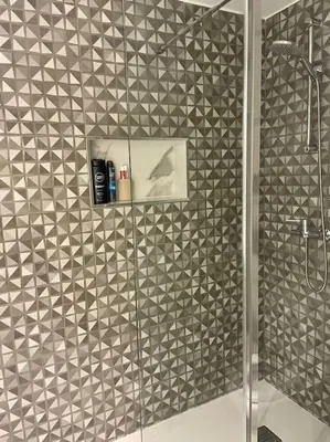 a bathroom with a shower with a glass door at Newly refurbished 2 bed appt Vilamoura in Vilamoura