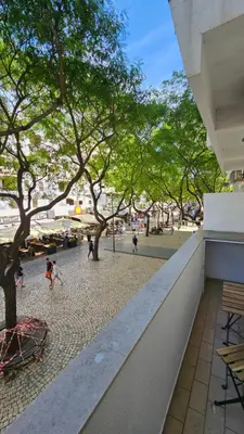 a view of a park from the balcony of a building at Original Studio Downtown in Albufeira