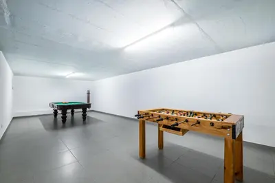 a room with a foosball table and a table sidx sidx sidx at Villa Aboim - BY BEDZY in Guia