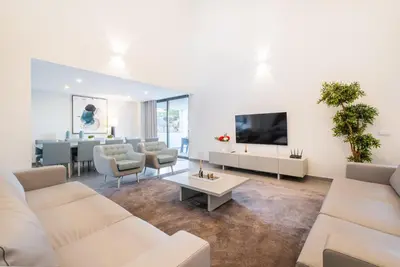 a living room with a couch and a table at Villa Aboim - BY BEDZY in Guia