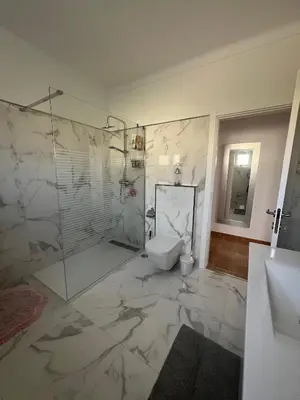 a bathroom with a shower and a toilet in it at Casa Amar in Loulé