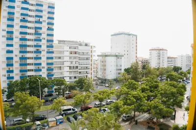 a view of a city with tall buildings at Happy House in Quarteira
