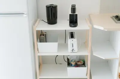 a white shelf with a blender on top of it at Happy House in Quarteira