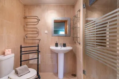 a bathroom with a sink and a toilet and a shower at Palmyra by Intiholidays in Vilamoura