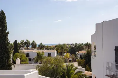 a view of houses and trees from a building at Welcoming Oasis 500m Beach AC Wi-Fi Pool Balcony in Albufeira