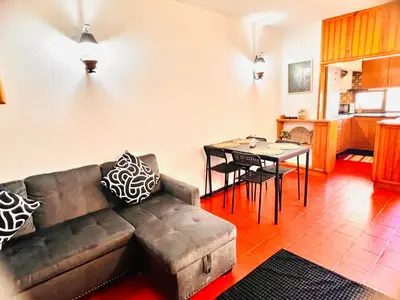 a living room with a couch and a table at Point Apartament Praia da Oura in Albufeira