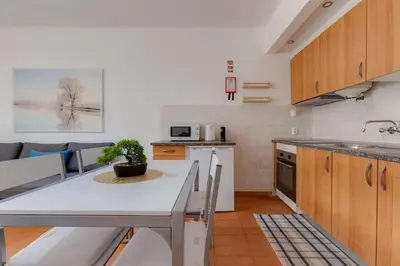 a kitchen with a white counter top in a room at VILA MAGNA - Apart renovado para 4 com piscina e Ar condicionado in Albufeira