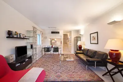 a living room with a couch and a table at Bia in Almancil