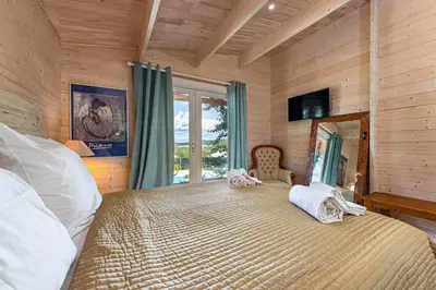 a bedroom with a large bed and a window at Design Chalet in Albufeira With Private Pool in Albufeira