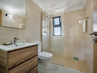 a bathroom with a toilet and a sink and a shower at Villa Corcovada V4 VIP Properties by Interhome in Albufeira