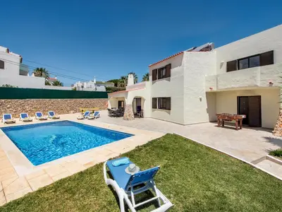 a villa with a swimming pool and a house at Villa Corcovada V4 VIP Properties by Interhome in Albufeira