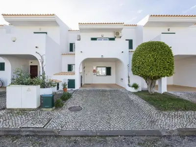 a large swimming pool in front of some buildings at Holiday Home Pierre by Interhome in Galé