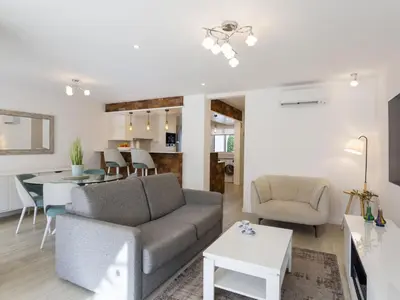 a living room with a couch and a tv at Holiday Home Pierre by Interhome in Galé
