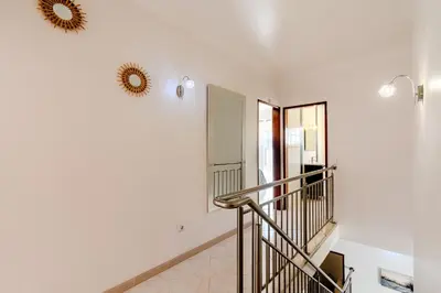 a bedroom with a bed with two towels on it at Villa Orange with private pool Albufeira in Albufeira
