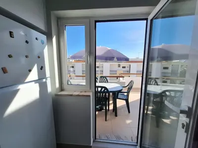 a balcony with a table and a view of a patio at AREIAS SOL in Albufeira