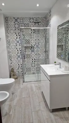 a bathroom with a shower and a toilet and a sink at AREIAS SOL in Albufeira