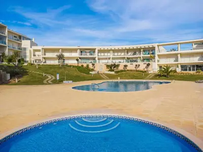 a large apartment building with a large swimming pool at Balaia Residense Penthouse 2 Bedroom Apartment with Pool in Albufeira