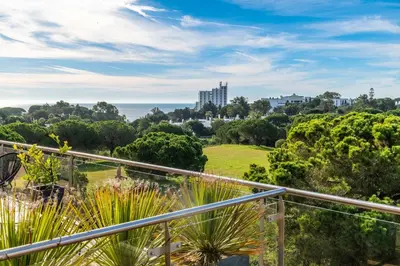 a view of the ocean from the balcony of a house at Balaia Residense Penthouse 2 Bedroom Apartment with Pool in Albufeira