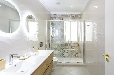 a bathroom with a shower and a sink at Blue Peacock in Faro