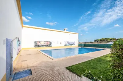 a swimming pool in the backyard of a house at #152 T1 Falésia by Home Holidays in Albufeira
