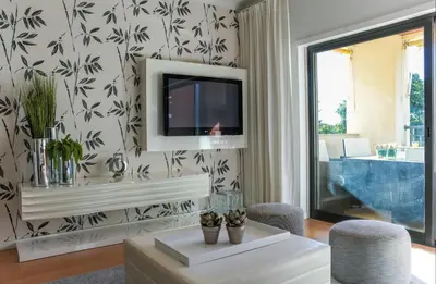 a living room with a couch and a table at Apartment - Vilamoura Pine By Dalma Portuguesa in Quarteira