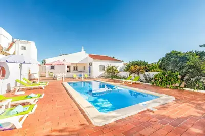a swimming pool in the backyard of a house at Villa Bento Dios in Galé