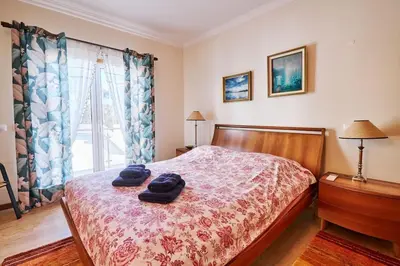 a bedroom with a bed with two towels on it at NEU - Casa Tina mit Meerblick und Pool in Guia
