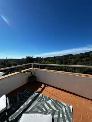 a balcony with a view of a blue sky at Casa Estrela in Loulé