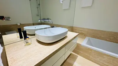 a bathroom with a large white sink on a counter at Two Bedroom Laguna Village - By Vilamoura Sun in Quarteira