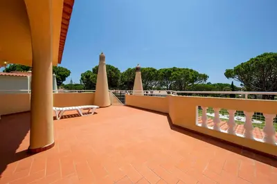 a balcony with a view of the water at Villa Daffodil Golf in Vilamoura