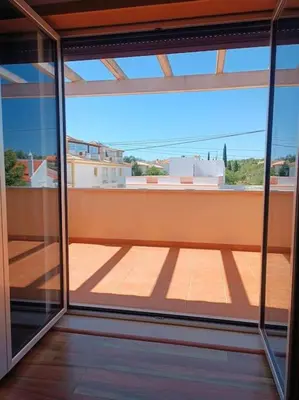 a view of a balcony from a room with glass doors at Holiday HouseV5 W/Pool & BBQ in Albufeira