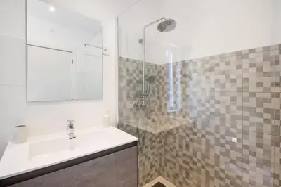 a bathroom with a sink and a shower at Villa Lynn - Quadradinhos in Almancil