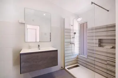 a bathroom with a sink and a shower at Villa Lynn - Quadradinhos in Almancil