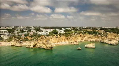 an aerial view of a beach with rocks in the water at Casa Esmarand in Albufeira