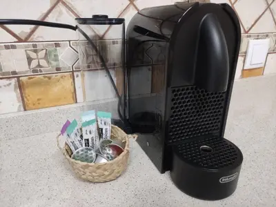 a coffee maker sitting on a counter with a basket at Casa da Madalena in Faro