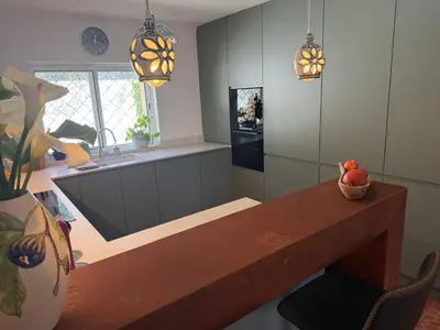 a bathroom with two sinks and a toilet and a mirror at Beach villa Casa de Amanhã 450 mts to the beach with beautiful garden and heated saltwater pool in Albufeira