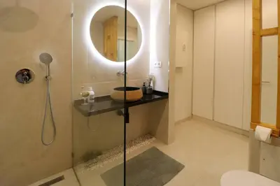 a bathroom with a shower with a mirror at Vilamoura Sunrise in Quarteira